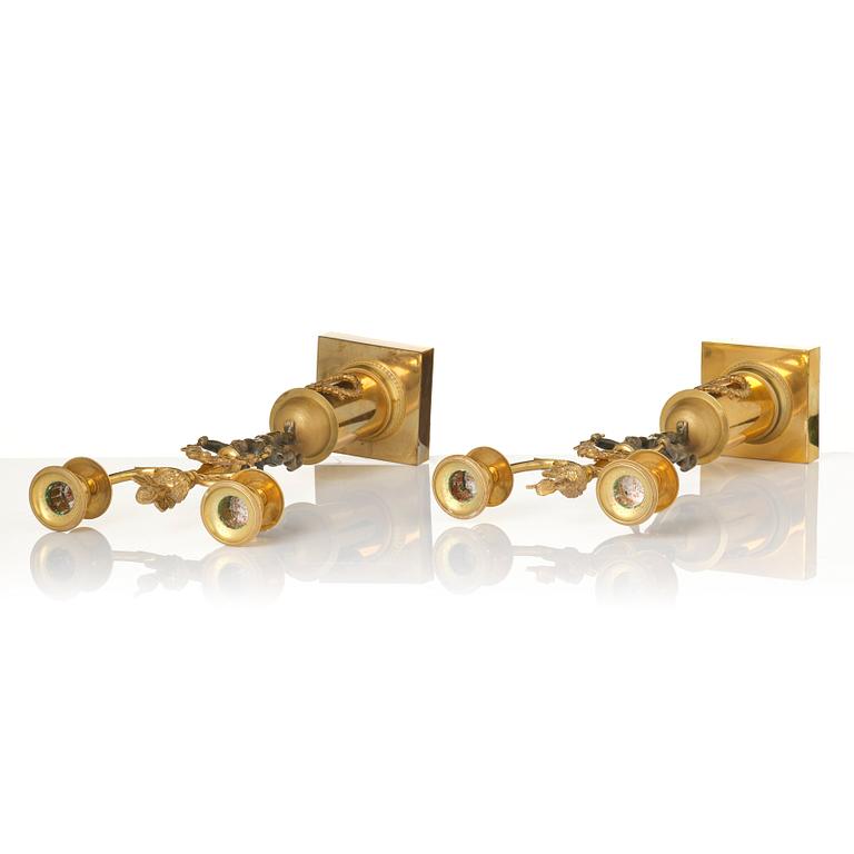 A pair of Empire gilt-brass two-branch candelabra, Stockholm, early 19th century.