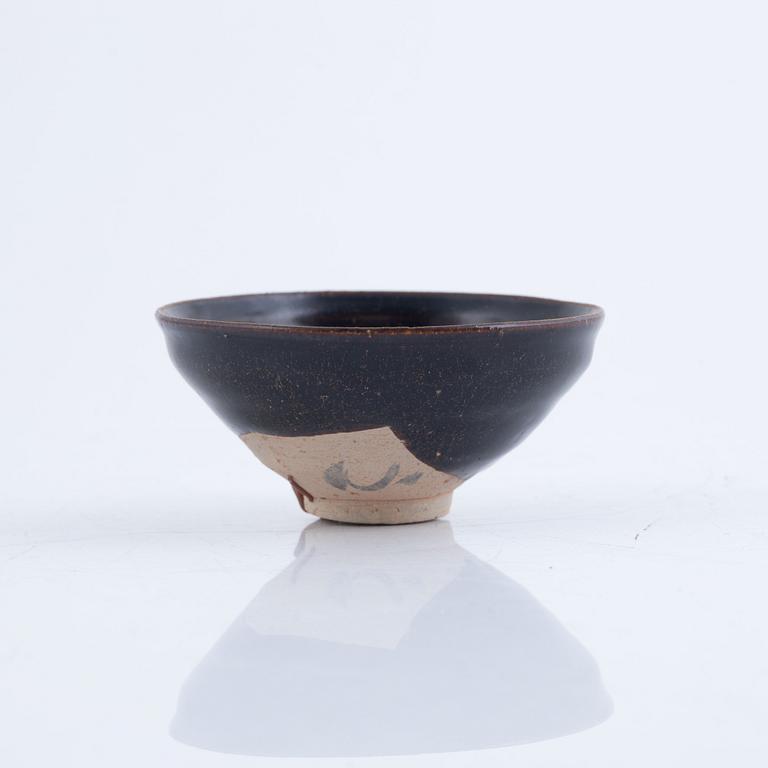 A tenmoku glazed Song style bowl, probably later.