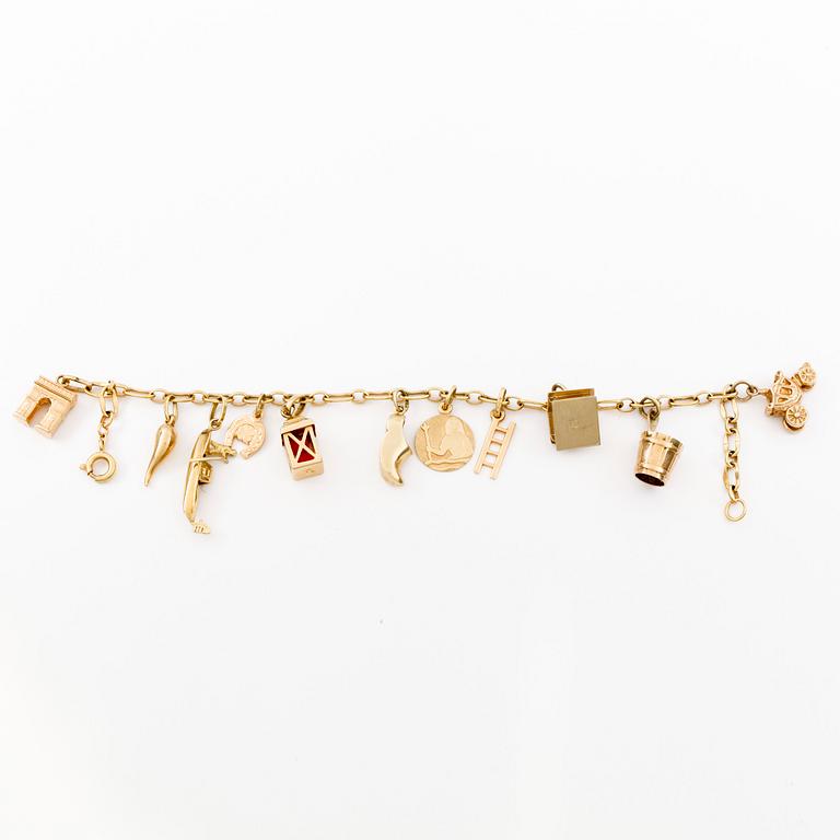 ARMBAND, 18k guld variant på ankarlänk med 11 berlocker (14k och 18k guld). Vikt 16g.