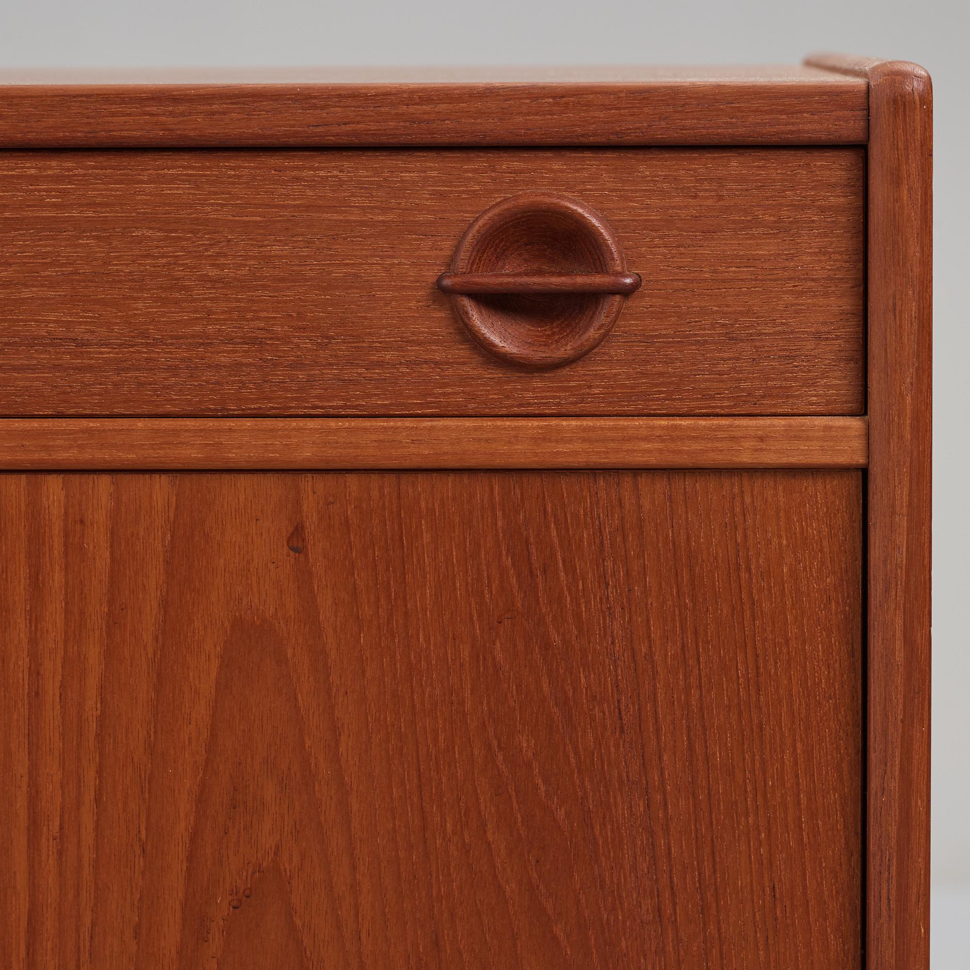 A late 20th Century teak veneered sideboard.