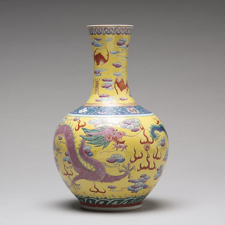 A yellow glazed five clawed dragon vase, probably late Qing dynasty with Guangxus mark.