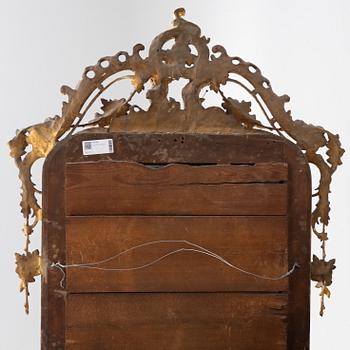 A giltwood mirror, second half of the 19th Century.