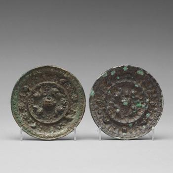 447. Two bronze mirrors with mythical animals,  Tang dynasty (618–907).