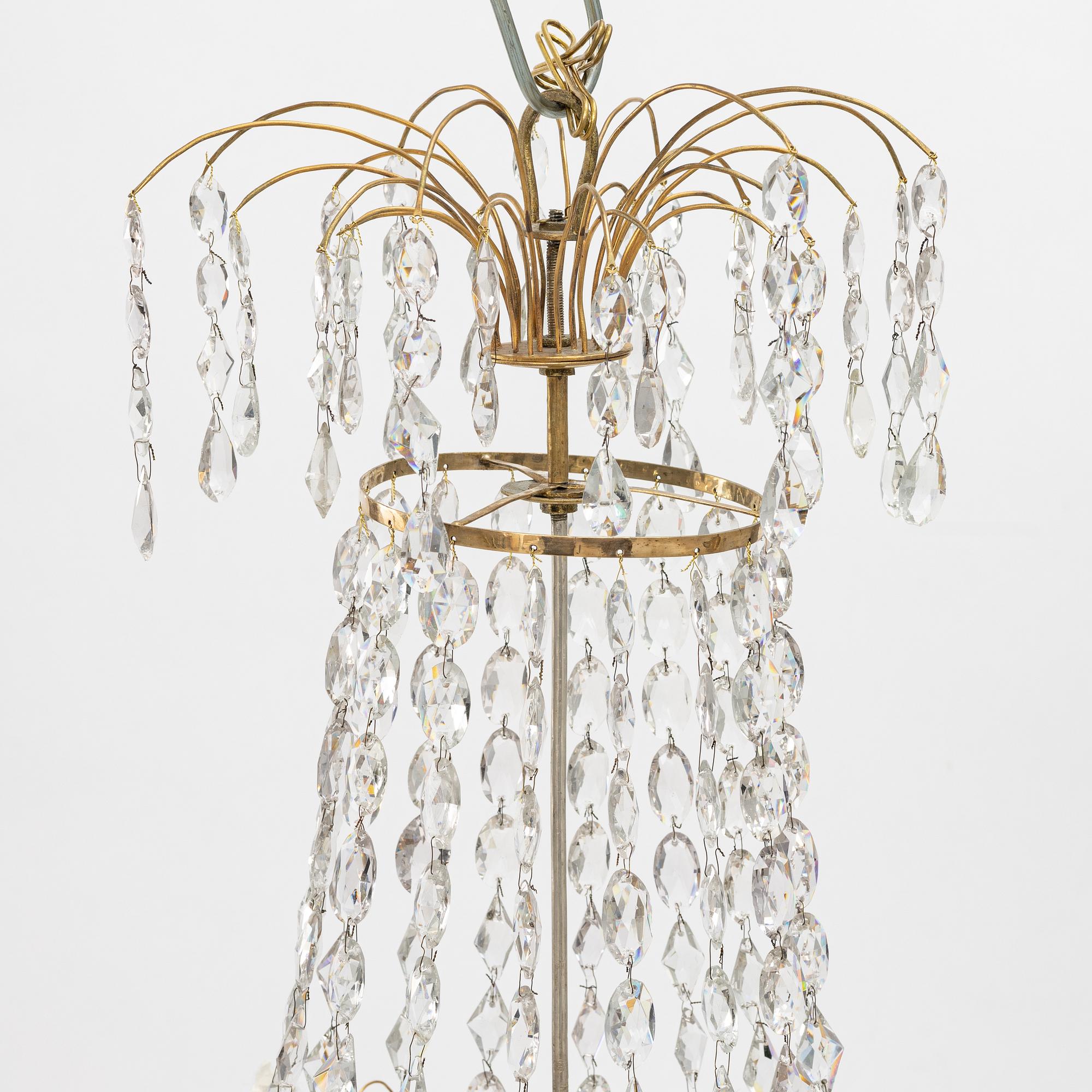 A Gustavian four-branch gilt-brass chandelier, Stockholm, late 18th century.