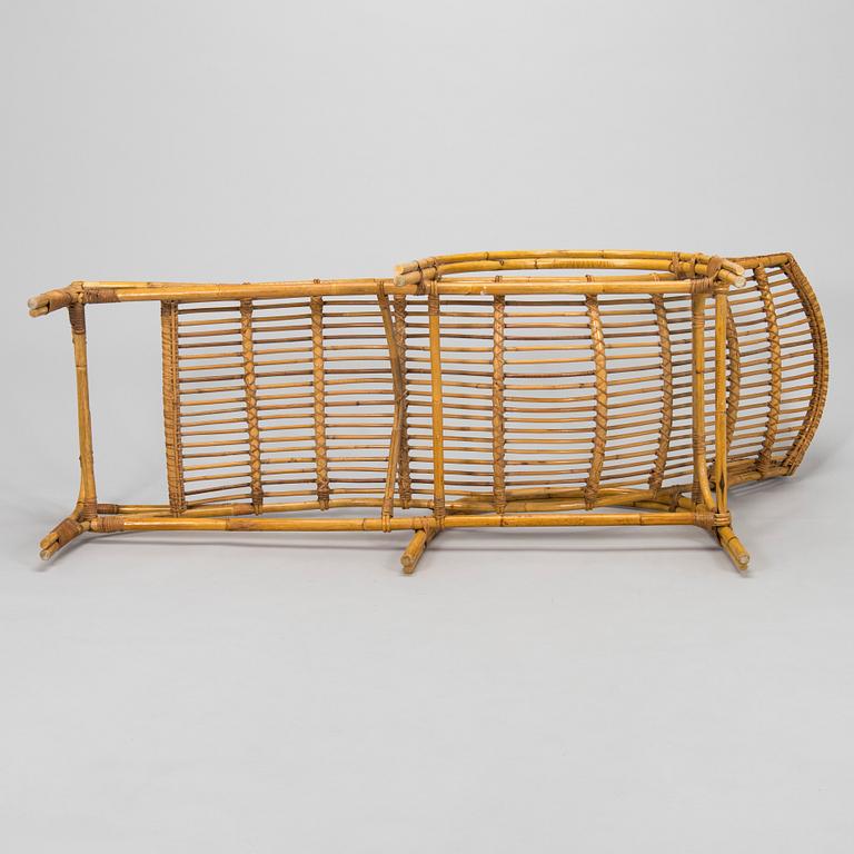 A mid-20th century rattan lounge chair.