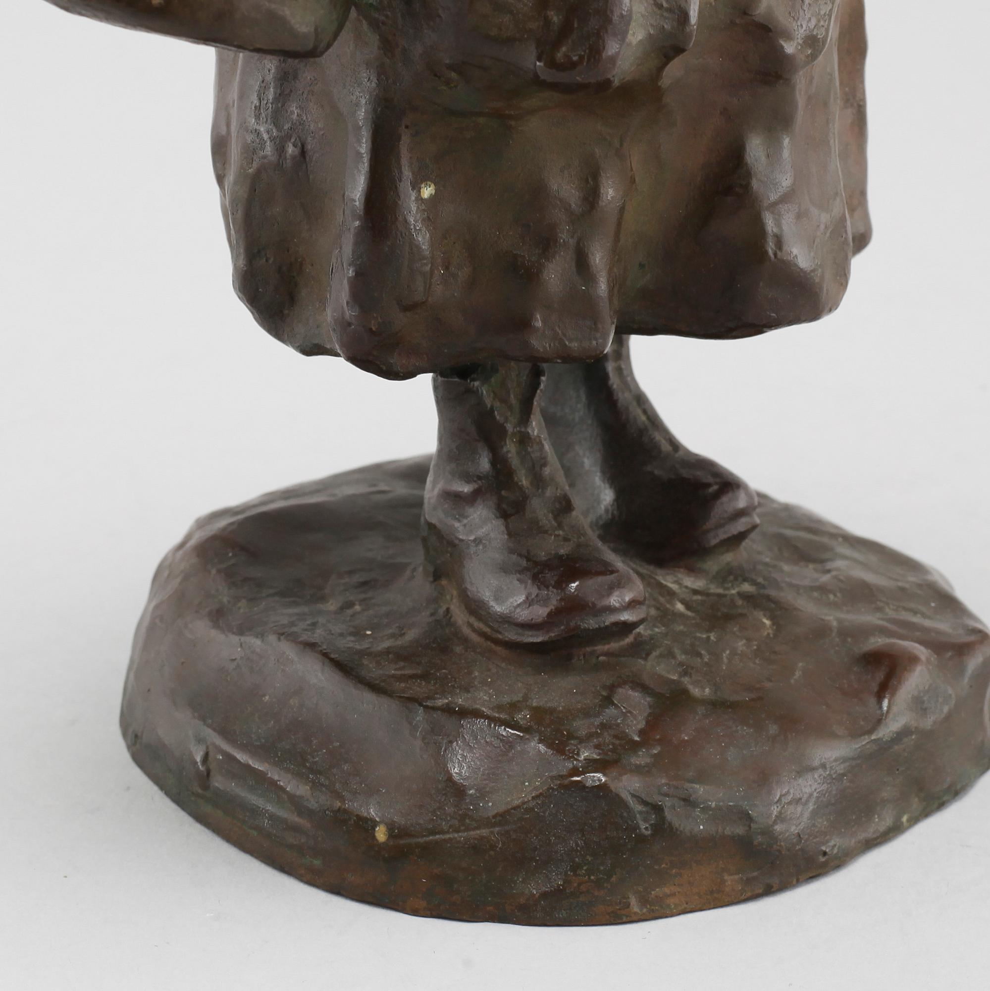 a bronze sculpture, signed and dated 1906.