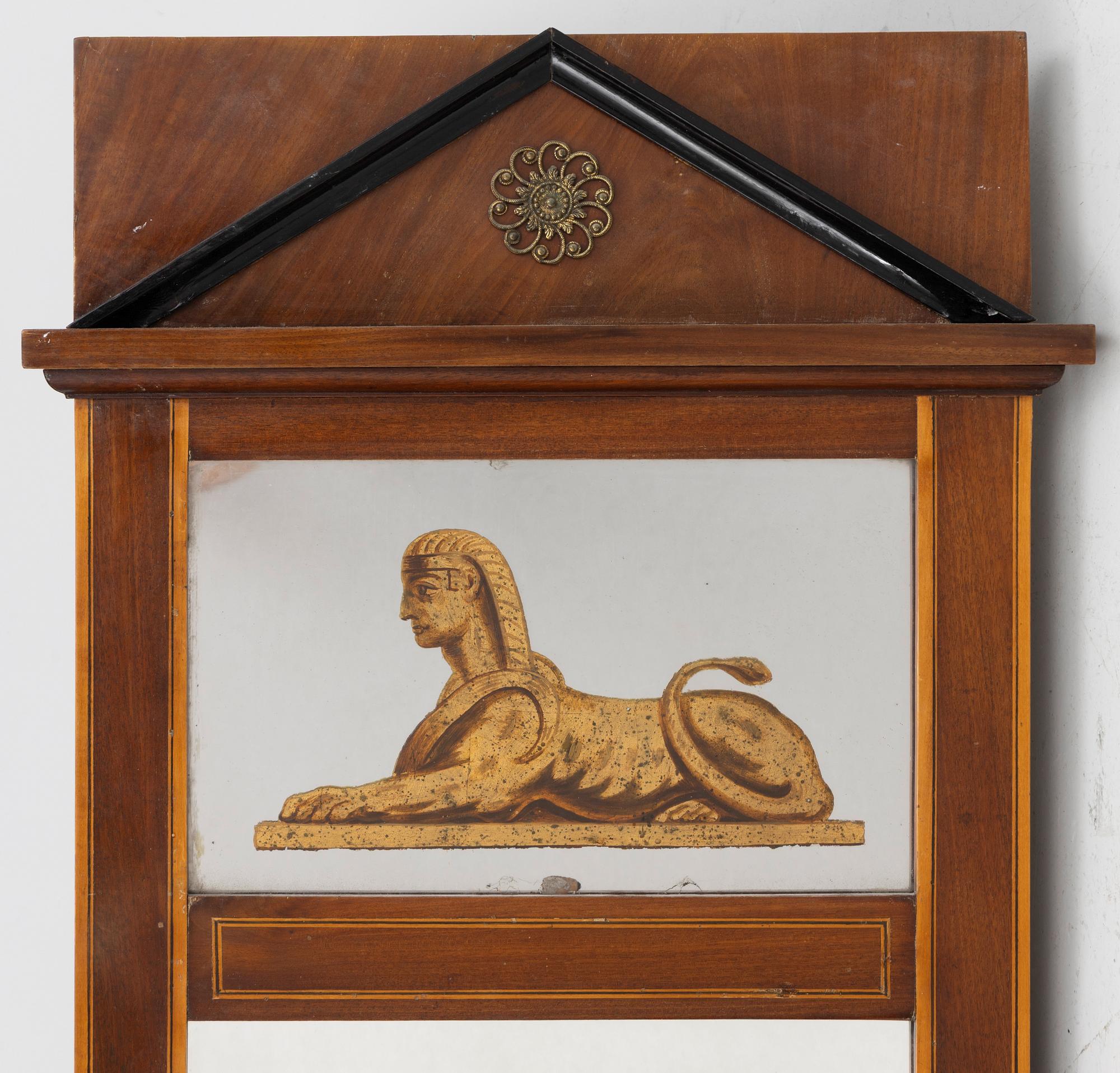 An Empire style mirror, second half of the 20th century.