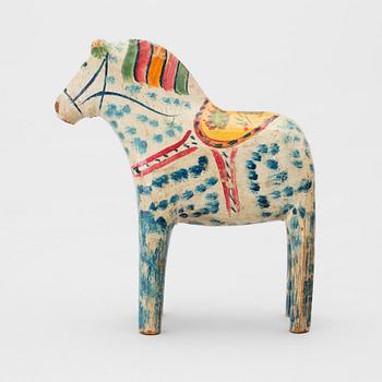 A painted folk art dala horse first half of the 20th century.