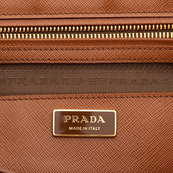 Prada, a brown Saffiano handbag.