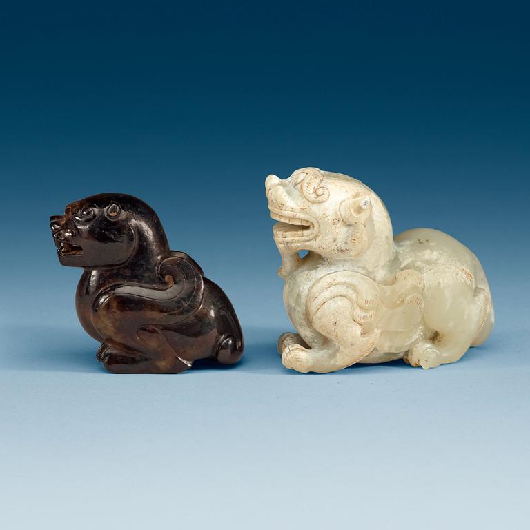 Two Chinese stone figures of mythical beasts.