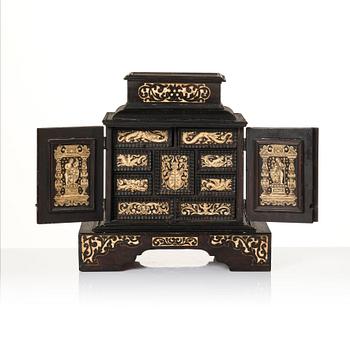 A South German, presumably Augsburg, ebony, ebonised and engraved bone inlaid table cabinet,  17th century.