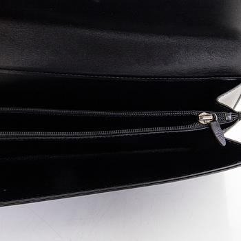 Louis Vuitton, an "Opera Egee" leather clutch.