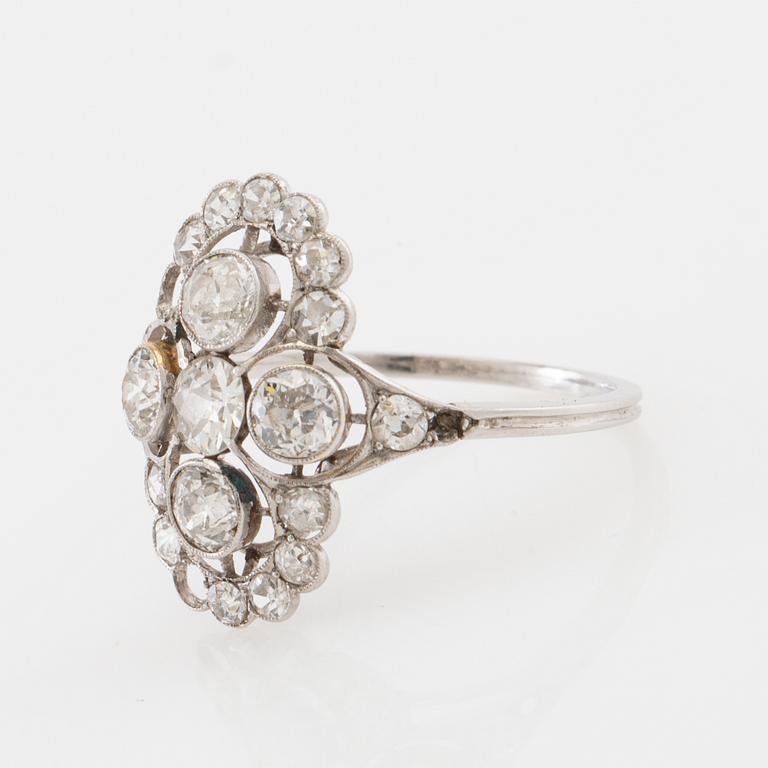 Platinum ring set with round old-cut diamonds, early 20th century.