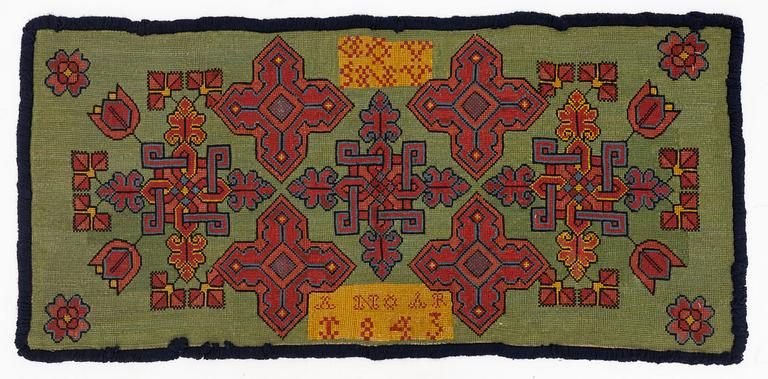 A carriage cushion, cross-stitch embroidered, Southwestern Scania, dated 1843.