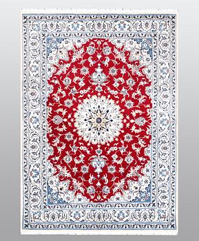 A carpet, Nain, part silk, ca 238 x 170 cm.