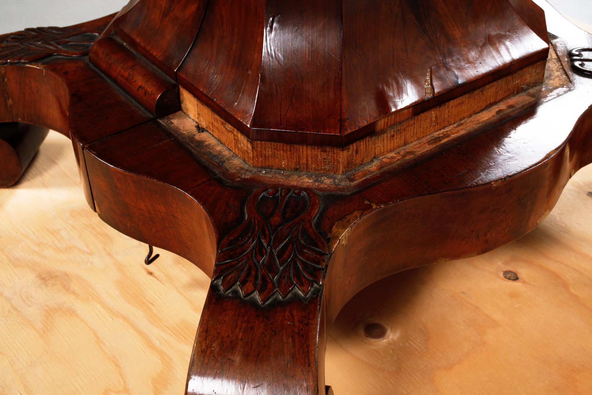 A late 19th century table with two extension leaves.