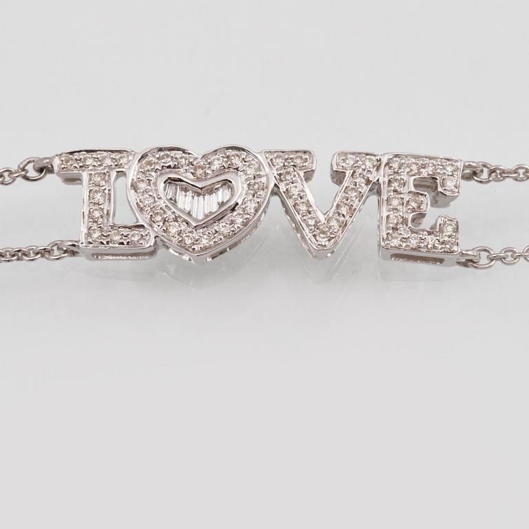 ARMBAND, 18K vitguld med briljant och baguettslipade diamanter ca 0.19 ct. Vikt 2,9 gram.