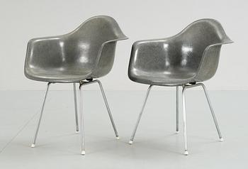 335. A pair of plastic chairs by Charles and Ray Eames.