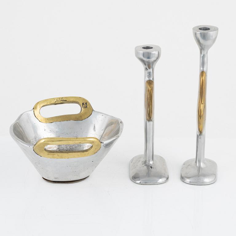 David Marshall, a metall and brass bowl and a pair of candle sticks.