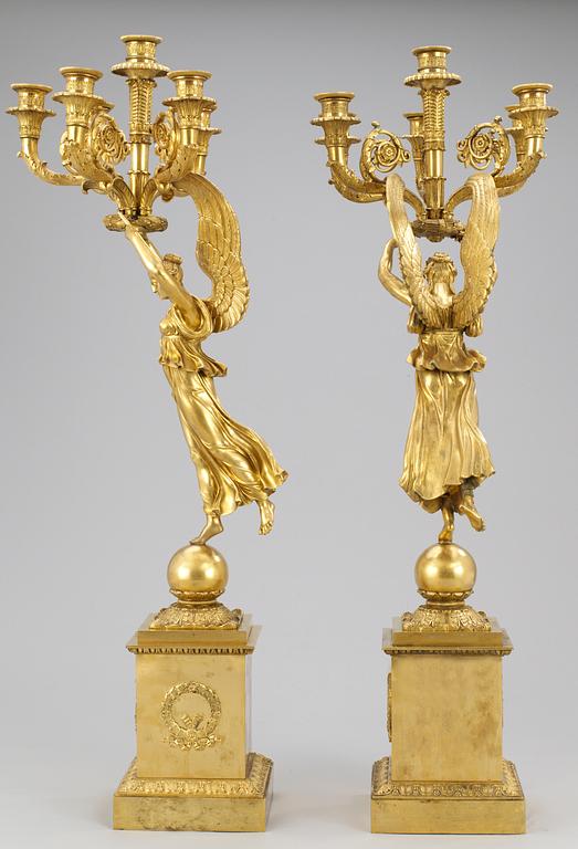 A pair of French Empire six-light candelabra.
