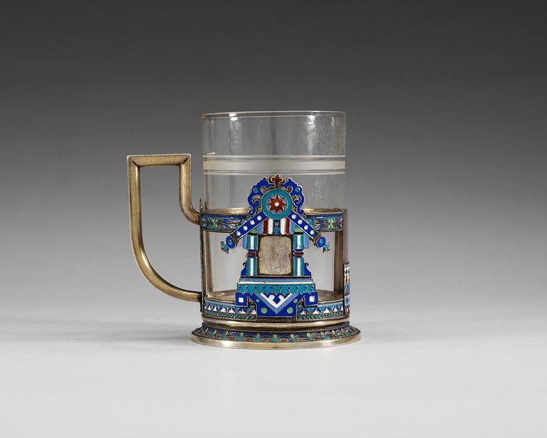 A RUSSIAN SILVER-GILT AND ENAMEL TEA-GLASS HOLDER, Makers mark of Soltykov, Moscow 1885.