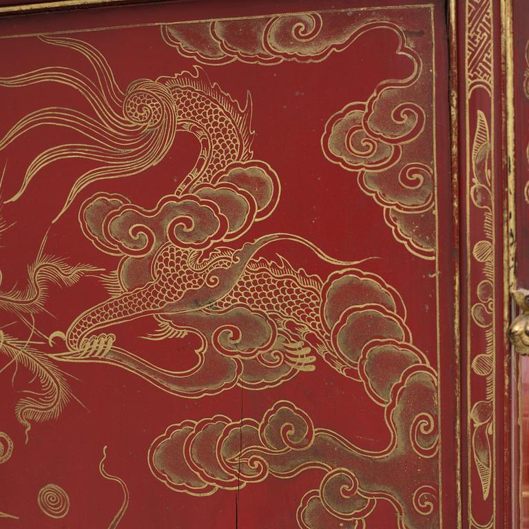 A Chinese red lacqured altar cabinet, late Qing dynasty/early 20th century.