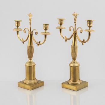 A pair of brass candelabra, first half/mid 19th century.