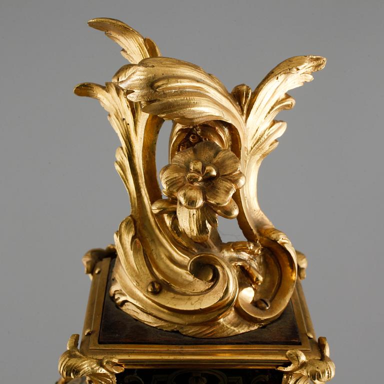 A 19th century mantle clock in the style of Louis XV.