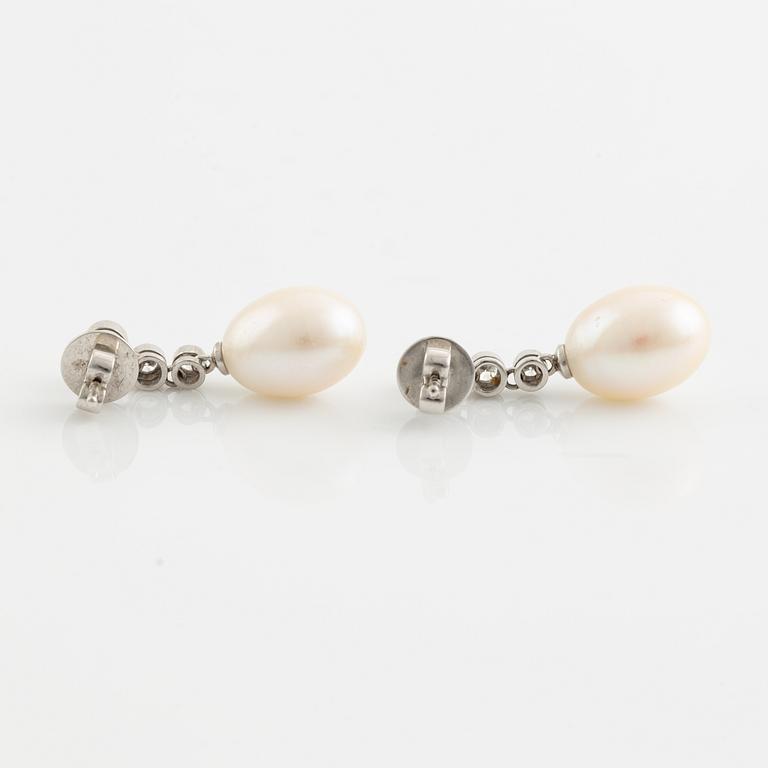 18K white gold, cultured pearl and brilliant cut diamond earrings.