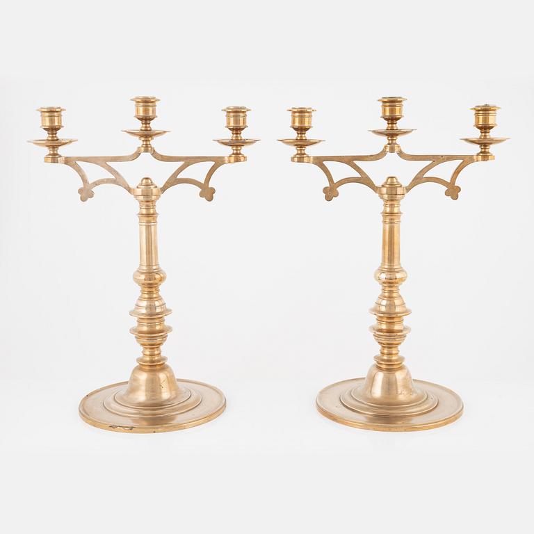 A pair of brass candelabra, early 20th Century.