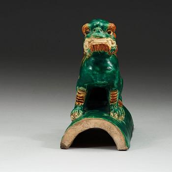 A sancai glazed roof tile figure of a mythological animal, Ming dynasty, 17th Century.