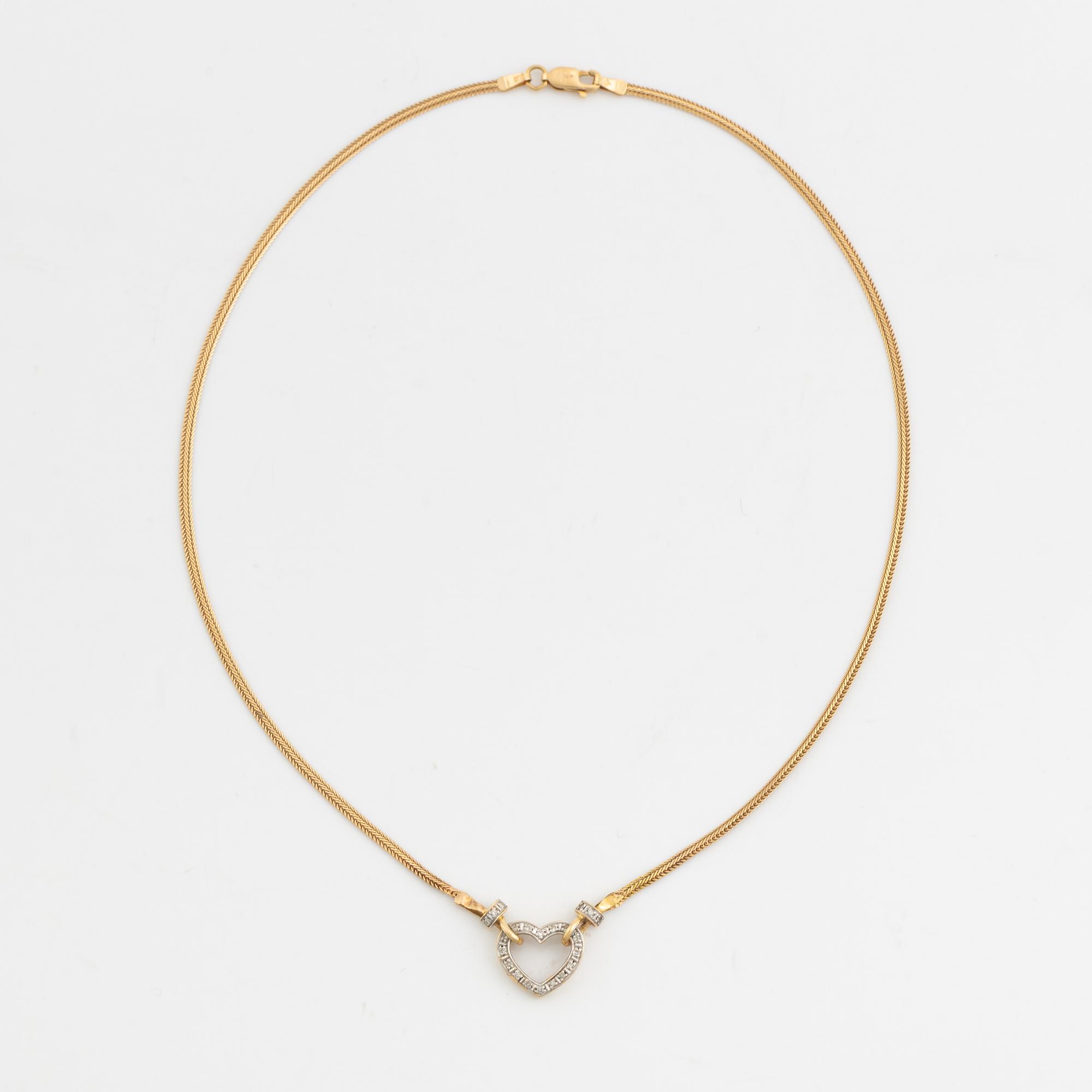 Gold and small diamond heart necklace.