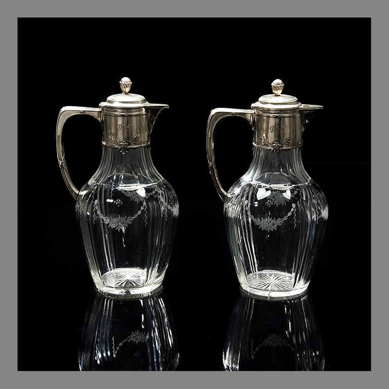 A PAIR OF WINE PITCHERS, silver and glass, Germany, Finnish import marks V. Lindman Helsinki 1909.