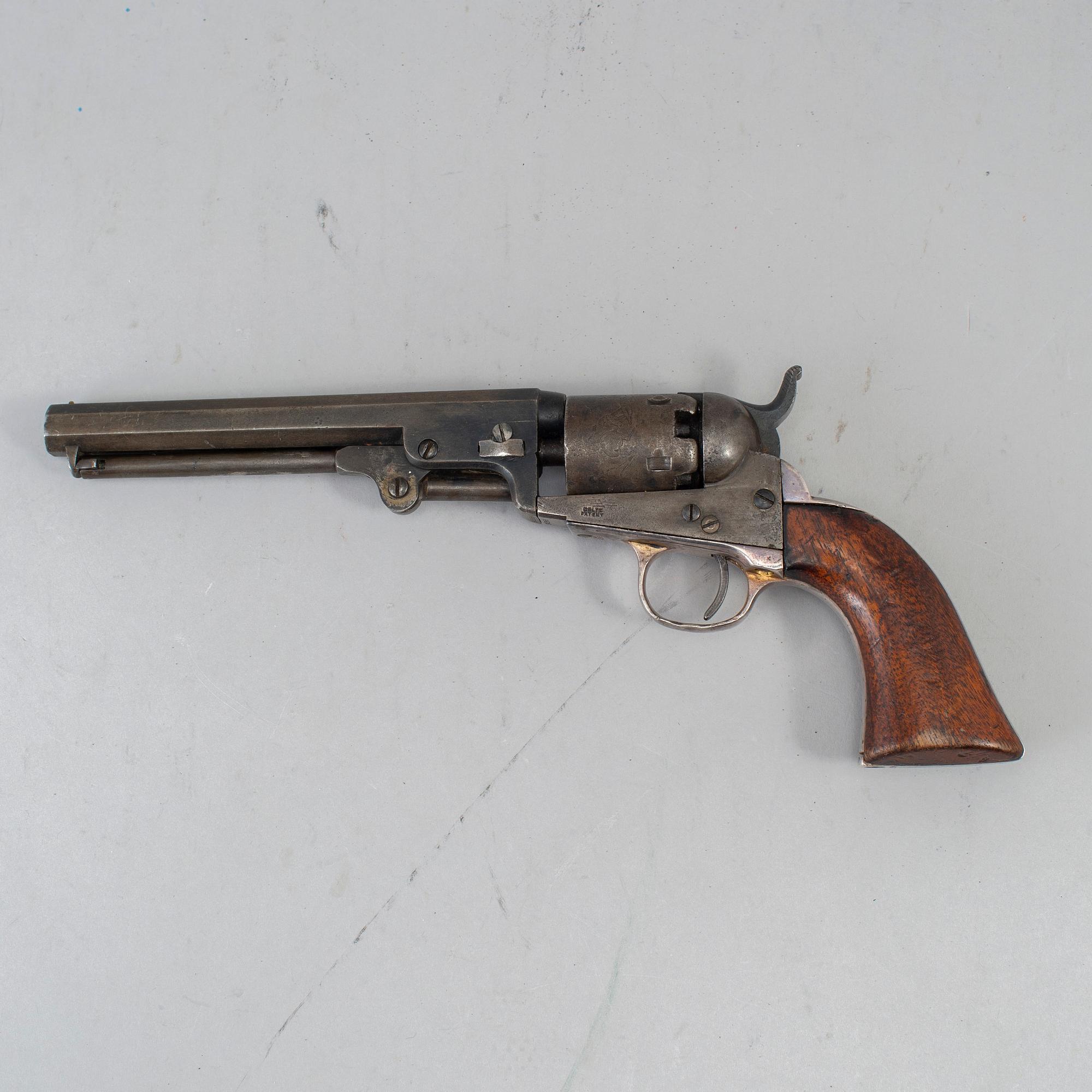 A Colt 1849 pocket percussion revolver with serial no 92569.