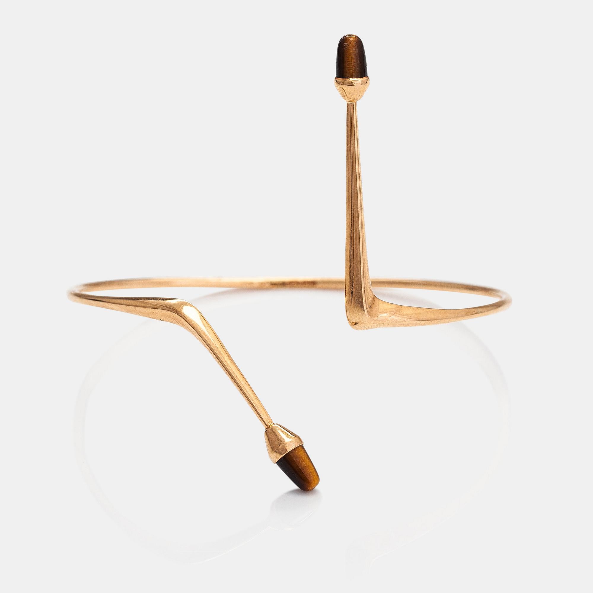 Elis Kauppi, A 14K gold bracelet/bangle with tiger's eyes. Kupittaan kulta, Turku 1961.