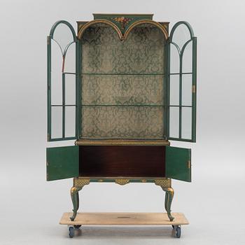 A display cabinet, England, early 20th Century.