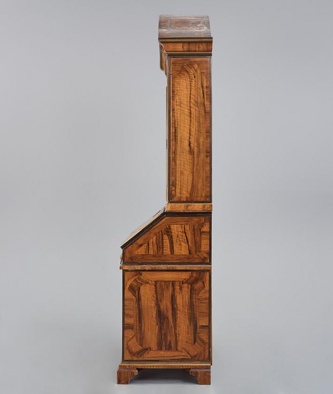 A late Baroque walnut veneer cabinet, mid 18th century.