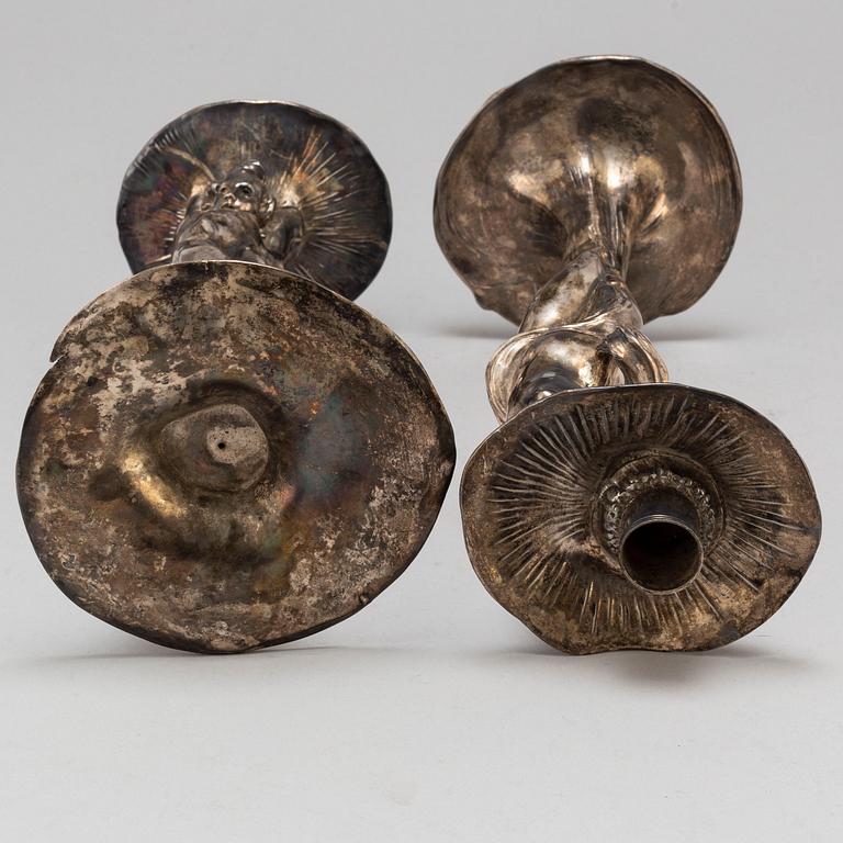 A 20th Century pair of art noveau style candle sticks marked A.W.OX.