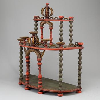 A 19th century painted wooden shelf.