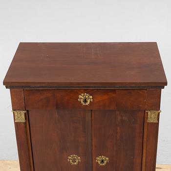 An Empire cabinet, first half of the 20th Century.