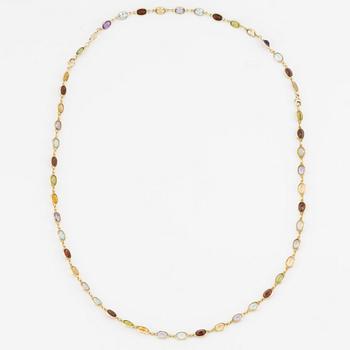 Necklace/bracelet in 18K gold with various coloured gemstones including topaz, citrine, amethyst, garnets, and peridot.