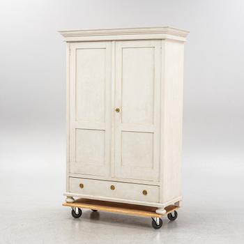 A painted clothes cabinet, 21st Century.