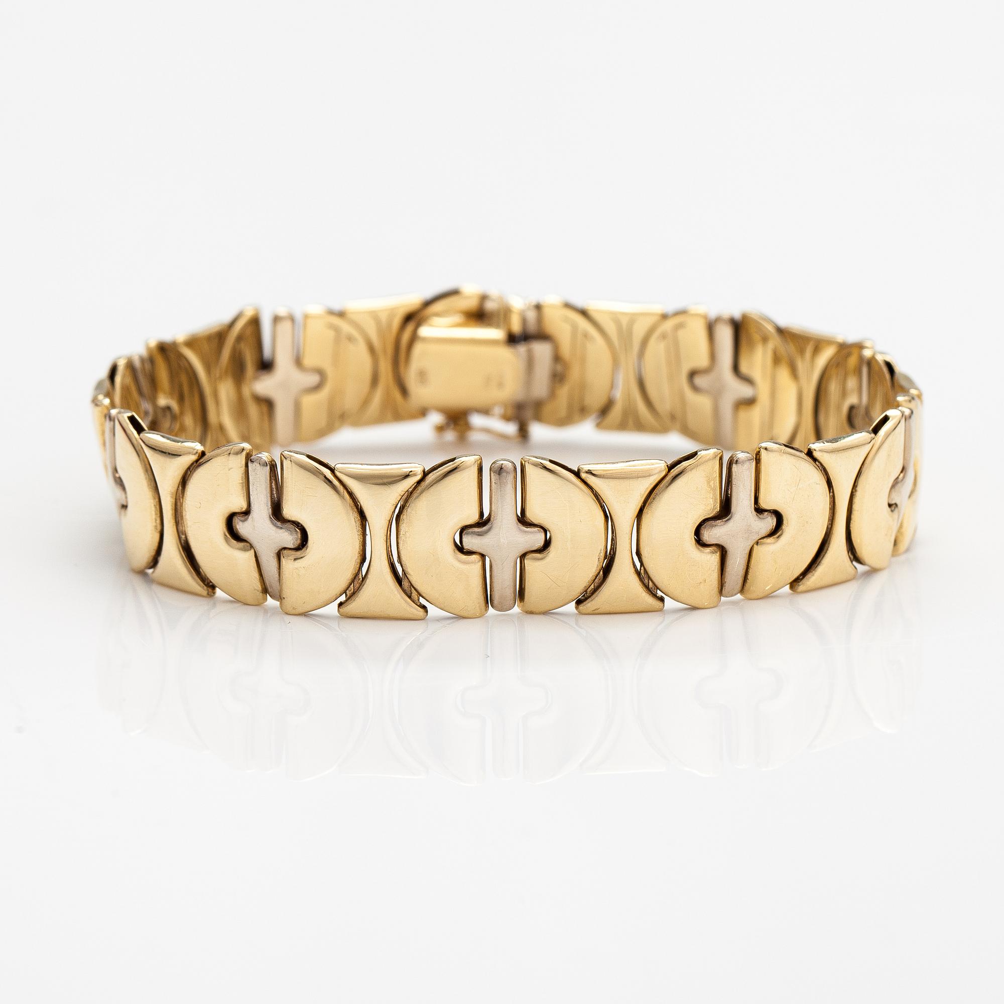 A 14K white and yellow gold bracelet.
