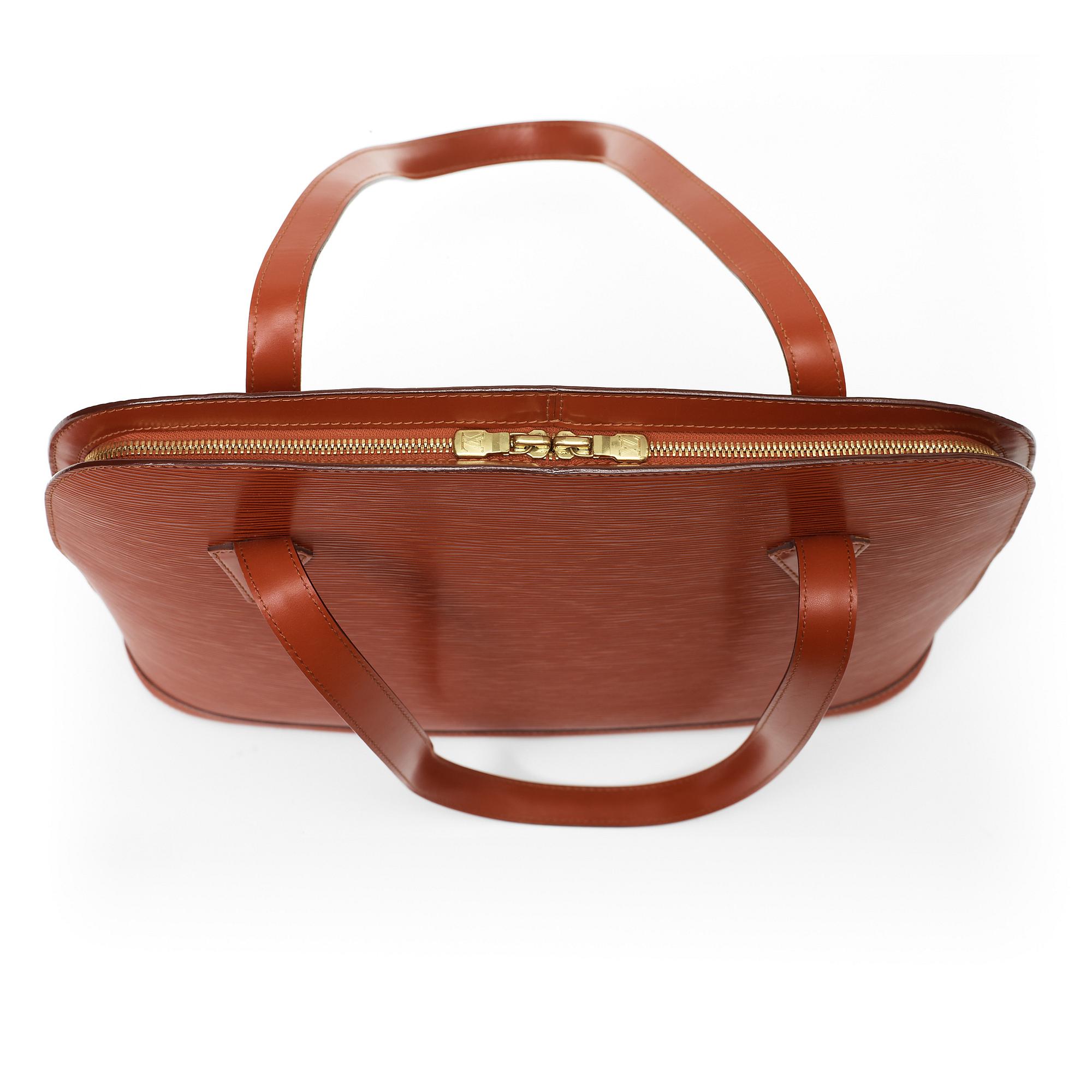 A 1999 terracotta epi leather handbag by Louis Vuitton.