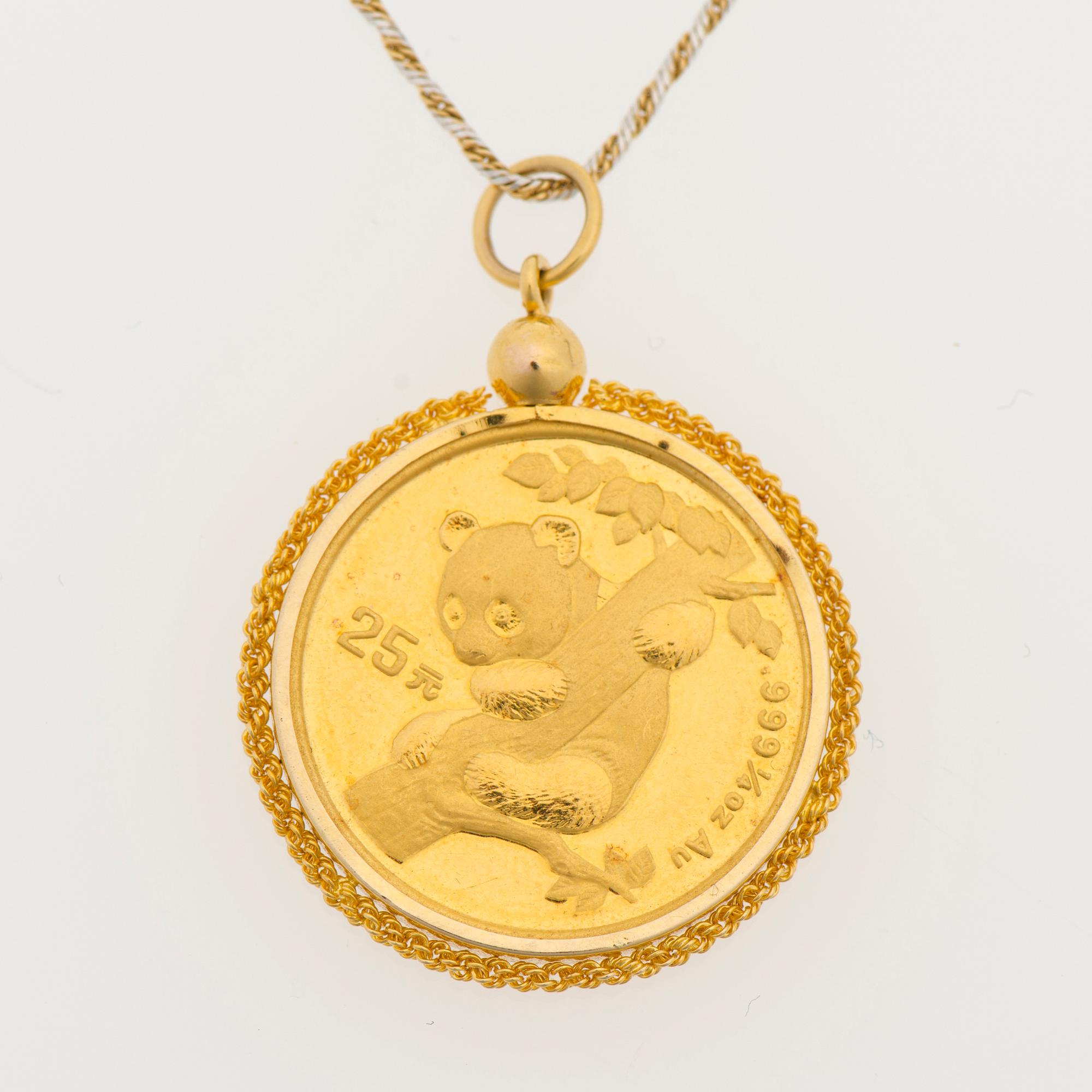 A PENDANT, gold coin 25 yen Japan 1996, setting 14K gold, chain 18K gold. -  Bukowskis