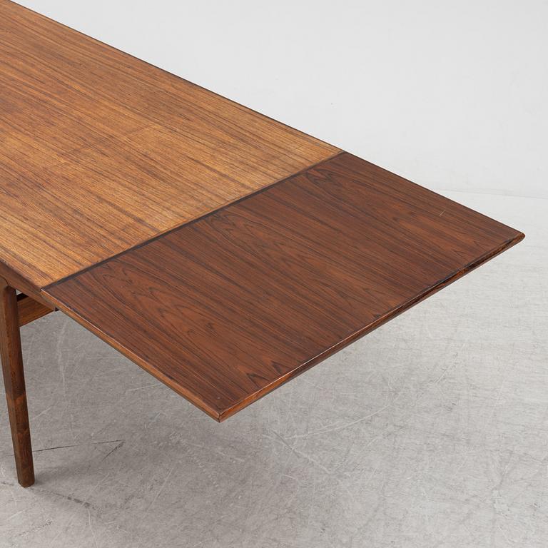 Henning Kjaernulf, a rosewood-veneered dining table from Vejle stole- og Mobelfabrik, Denmark, 1960's.