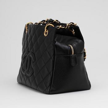 CHANEL, a black leather "Medium Shopping" handbag.