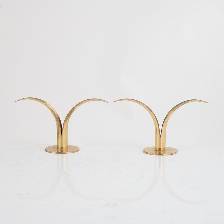 Ivar Ålenius-Björk, four brass candlesticks, Ystad Metall, mid 20th century.