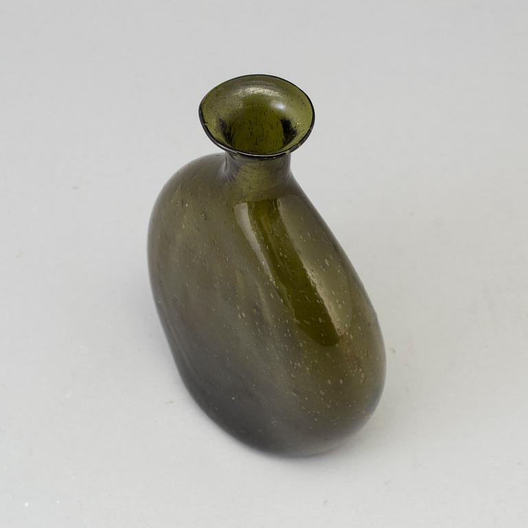 A 18th century glass bottle.