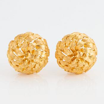 1018. A pair of 18K gold earrings.